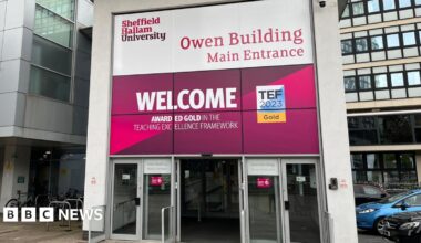 Sheffield Hallam University is a modern building with bright pink and purple branding which says Owen Building Main Entrance