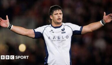 Benhard Janse van Rensburg lifts his arms in the air while in action for Bristol Bears