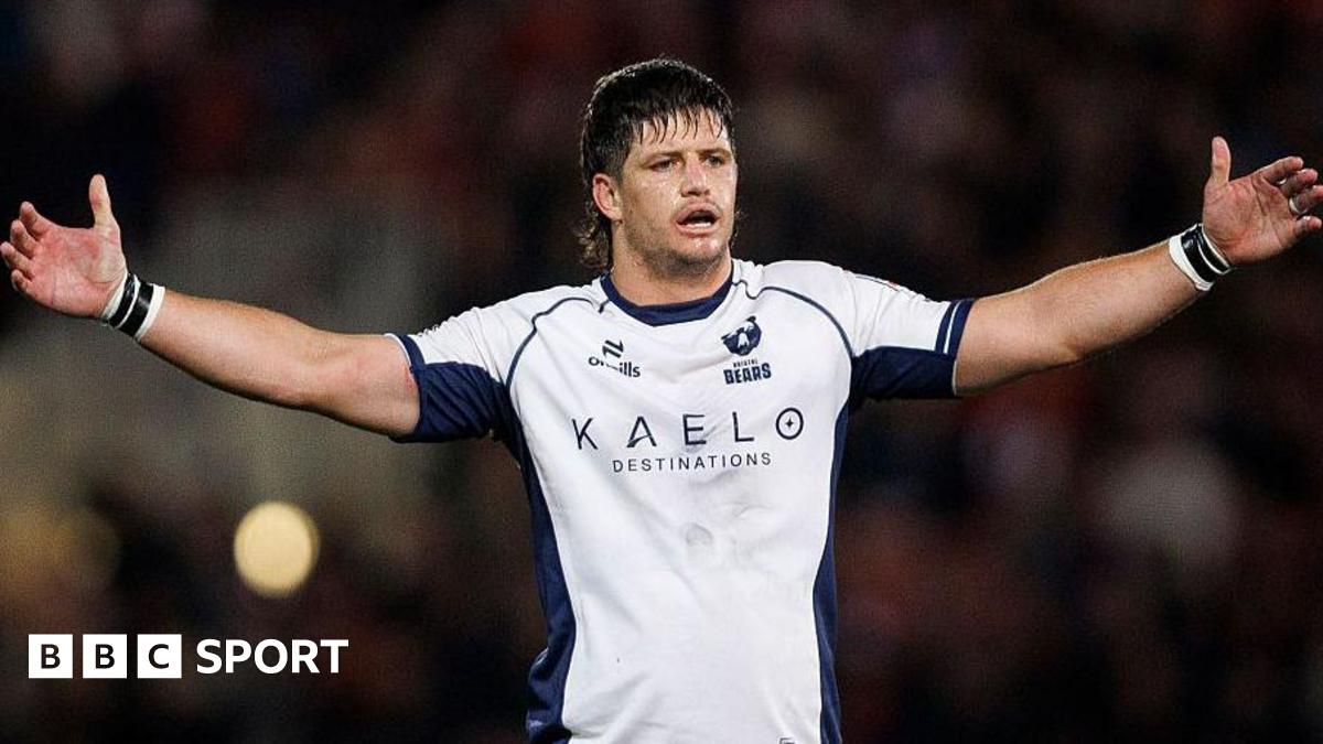 Benhard Janse van Rensburg lifts his arms in the air while in action for Bristol Bears