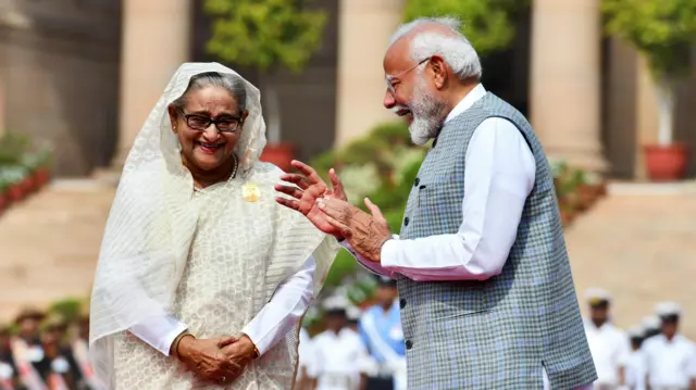 India's Prime Minister Narendra Modi speaks with Bangladesh's Prime Minister Sheikh Hasina during her ceremonial reception at the Forecourt of India's Rashtrapati Bhavan Presidential Palace, in New Delhi, India, June 22, 2024.