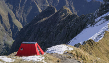 bergamo's modern art gallery embeds red bivouac shelter on the alps