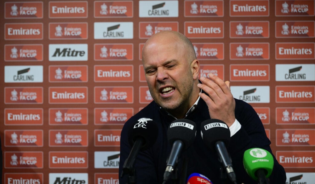 Arne Slot reacts angrily during a press conference