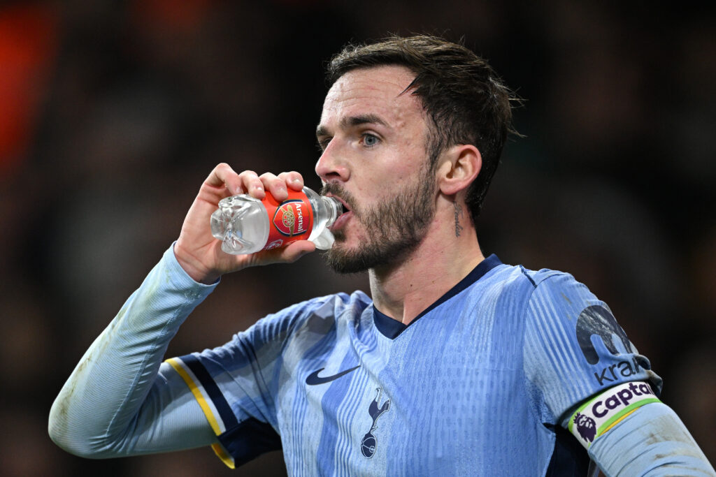 LONDON, ENGLAND - JANUARY 15: James Maddison of Tottenham Hotspur drinks from arsenal water bottle during the Premier League match between Arsenal FC and Tottenham Hotspur FC at Emirates Stadium on January 15, 2025 in London, England. (Photo by Justin Setterfield/Getty Images)