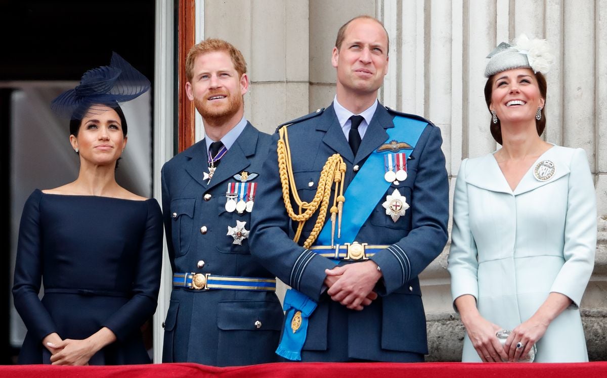 Meghan, Duchess of Sussex, Prince Harry, Duke of Sussex, Prince William, Duke of Cambridge and Catherine, Duchess of Cambridge watch a flypast to mark the centenary of the Royal Air Force from the balcony of Buckingham Palace on July 10, 2018