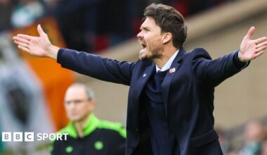 Referee Nick Walsh shows Celtic's Auston Trusty a yellow card