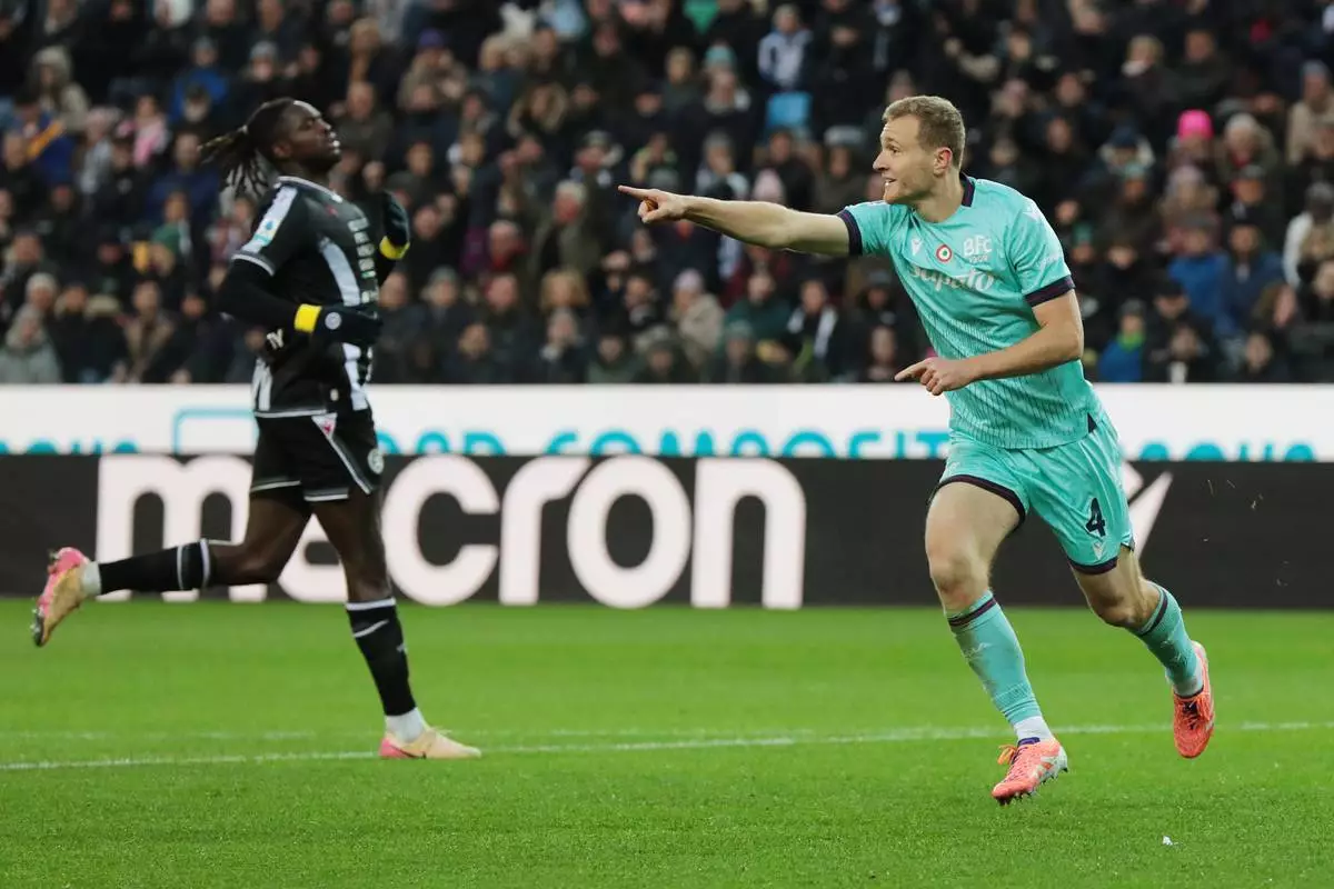 Bologna's Tommaso Pobega celebrates after scoring their side's first goal of the game during the Serie A soccer match between Udinese and Bologna in Udine, Italy, Saturday, Nov. 22, 2025. (Andrea Bressanutti/LaPresse via AP)