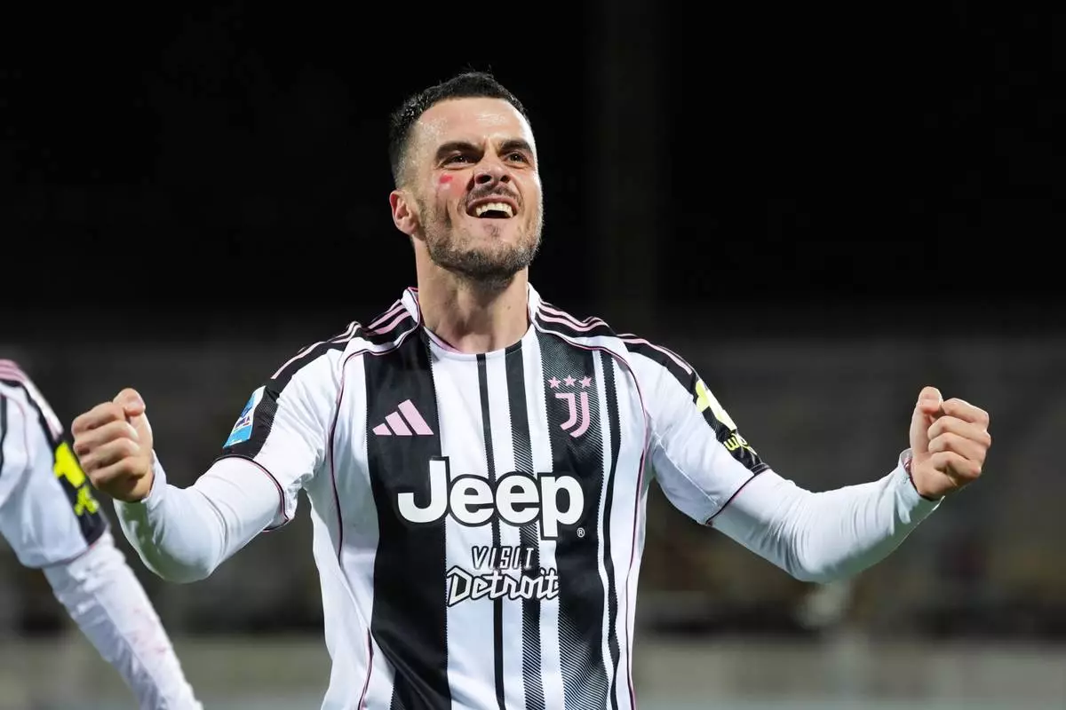 Juventus' Filip Kostic celebrates scoring during the Serie A soccer match between Fiorentina and Juventus in Florence, Italy, Saturday Nov. 22, 2025. (Massimo Paolone/LaPresse via AP)