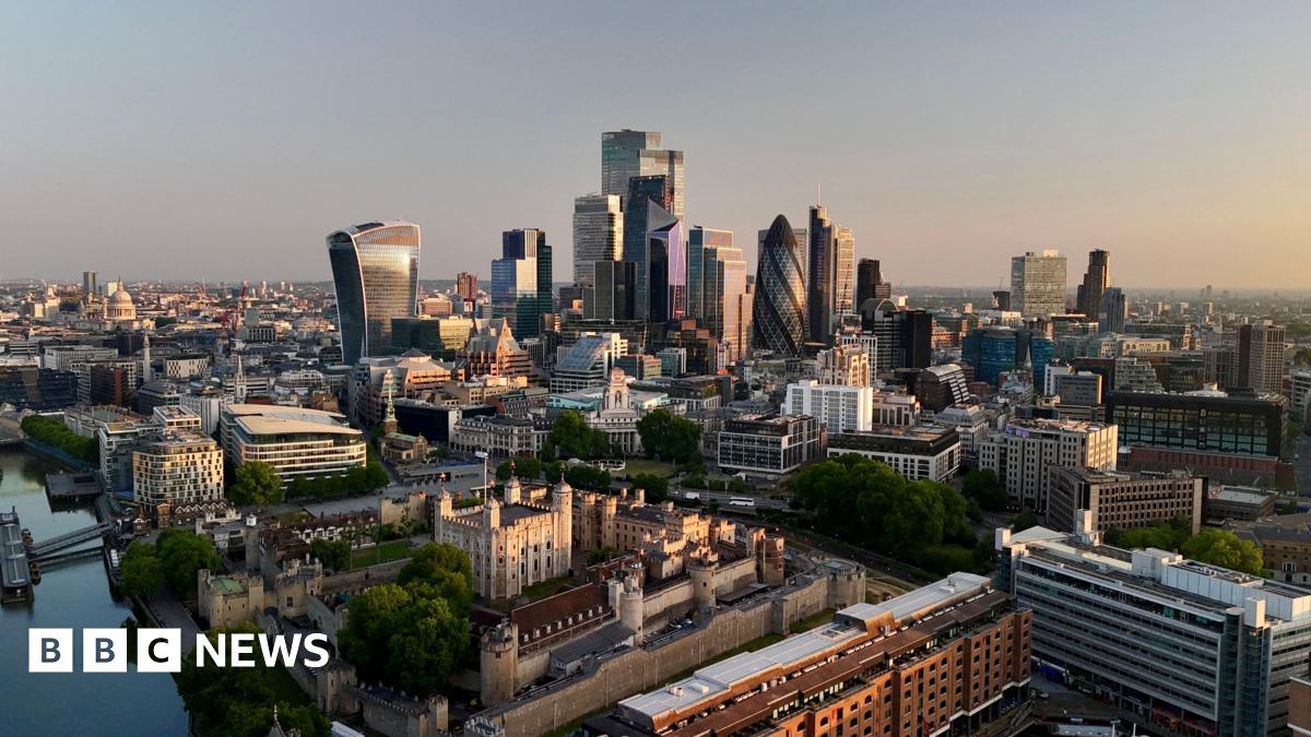 Day breaks over the City of London, with buildings visible including the Walkie Talkie and the Gherkin.