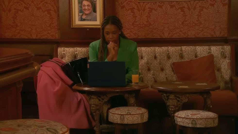 Coronation Street Dee Dee Bailey coronation street dee dee bailey in a green outfit working on a laptop in the rovers