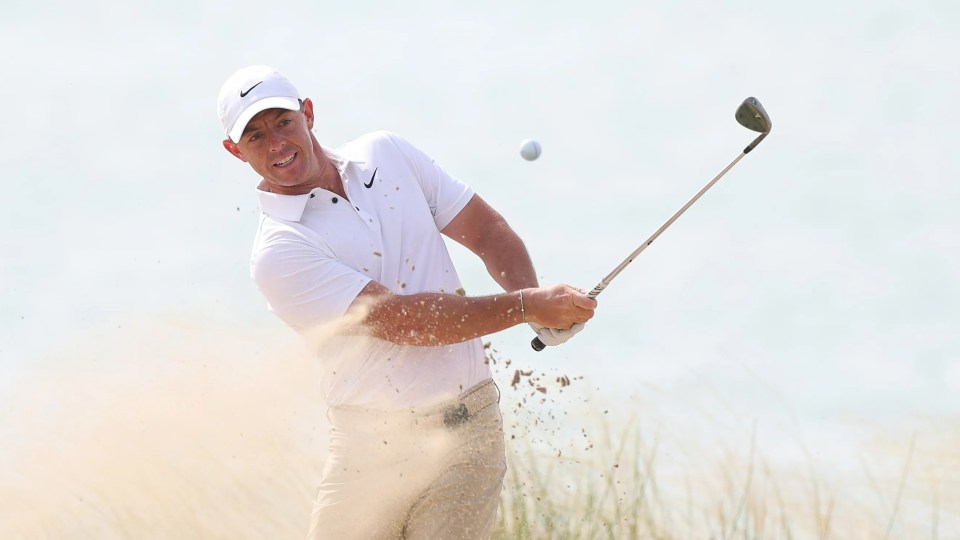 Rory McIlroy plays a bunker shot