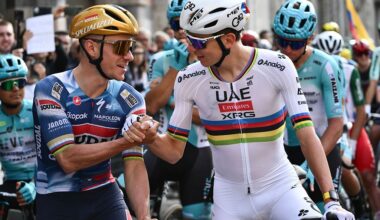 Soudal Quick-Step’s Belgian rider Remco Evenepoel (L) speaks with UAE Team Emirates’s Slovenian rider Tadej Pogacar (R) ahead of the 119th edition of the Giro di Lombardia (Tour of Lombardy), a 238km cycling race from Como to Bergamo on October 11, 2025. (Photo by Marco BERTORELLO / AFP)