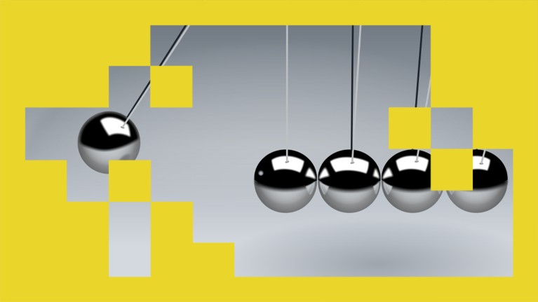 A close up view of a single ball swinging to collide with four others in a silver metallic Newton's cradle.