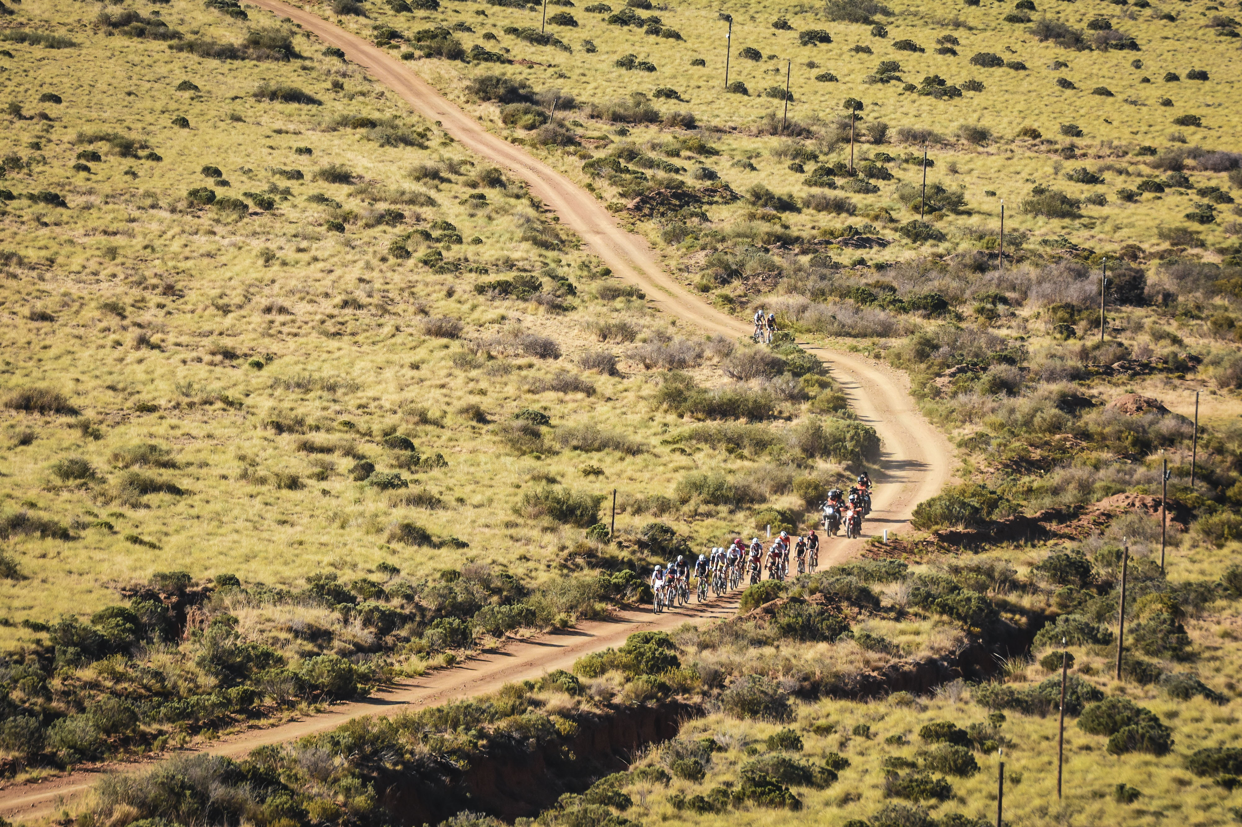 Riders in the distance tackling the harsh roads of Gravel Burn
