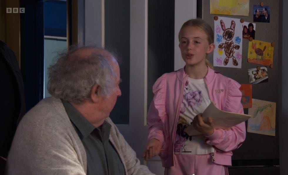 EastEnders, Nigel Bates and Lexi Mitchell eastenders, nigel bates and lexi mitchell in the kitchenm when lexi holding a script in her hand