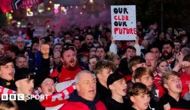 Salford Red Devils fans protest before their game against St Helens towards the end of the 2025 season