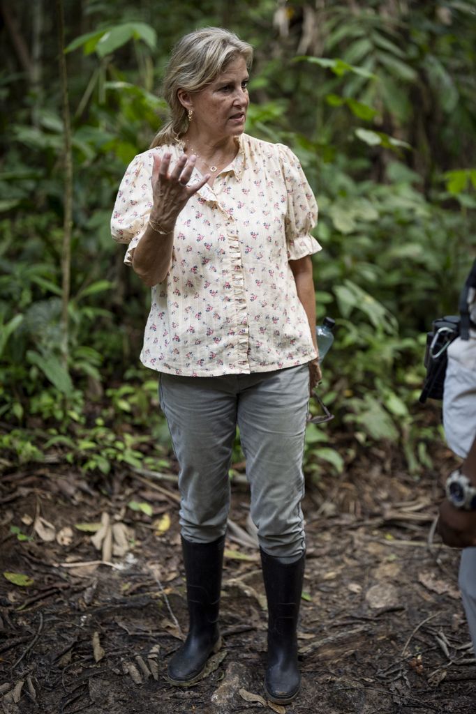 The Duchess of Edinburgh in rainforest in welly boots and floral blouse