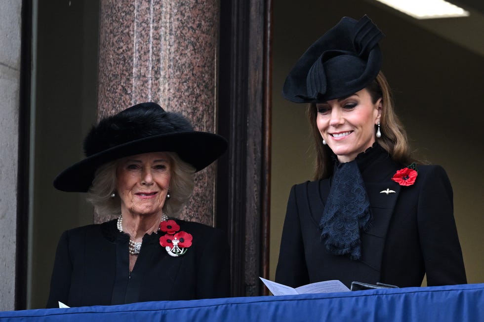 london, england november 09: queen camilla and catherine, princess of wales smile during the 2025 national service of remembrance at the cenotaph on november 09, 2025 in london, england. every year, members of the british royal family join politicians, veterans and members of the public to remember those who have died in combat. (photo by samir hussein/wireimage)