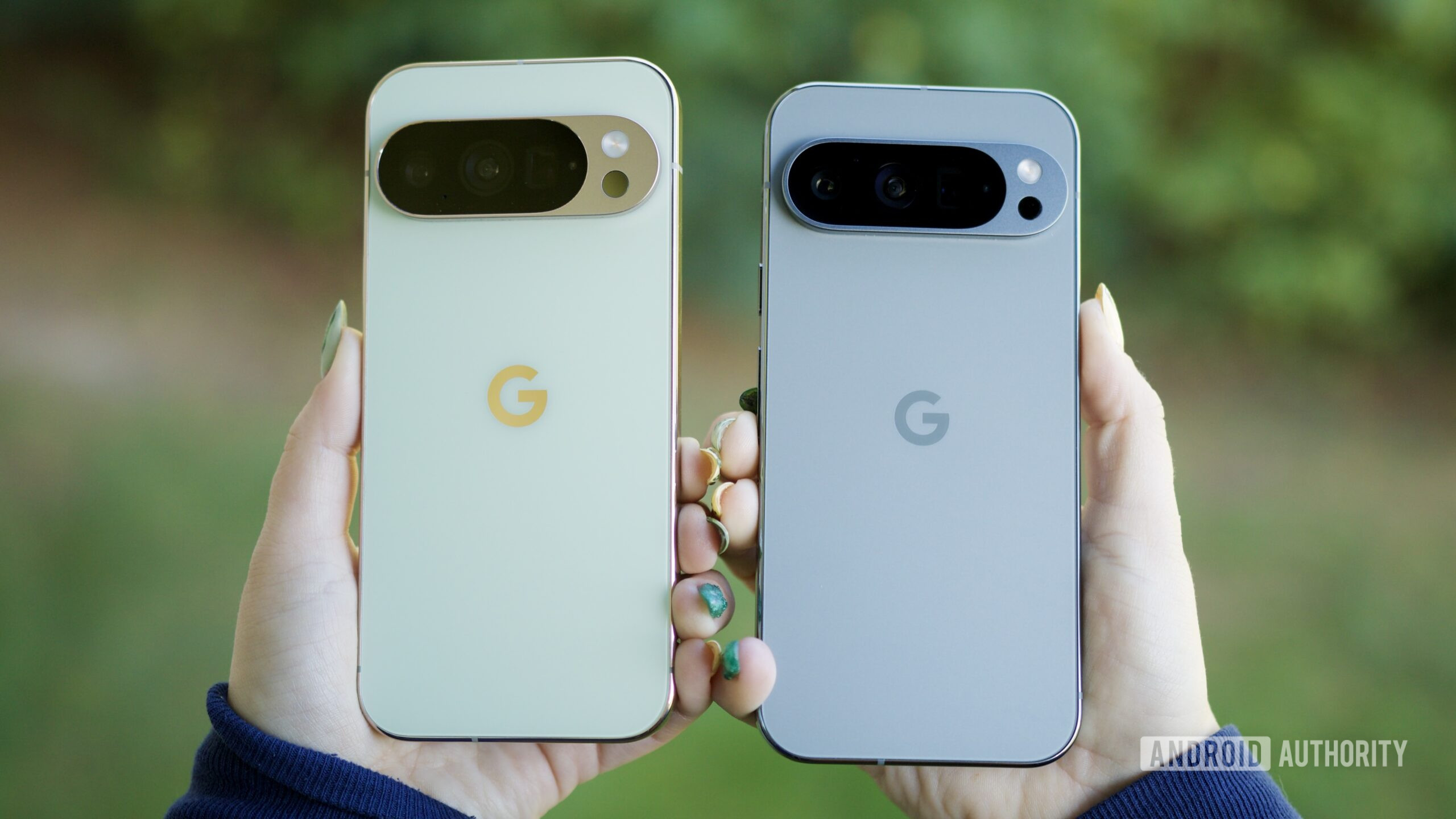 Someone holding the Pixel 10 Pro and Pixel 9 Pro, showing the backs of the phones.