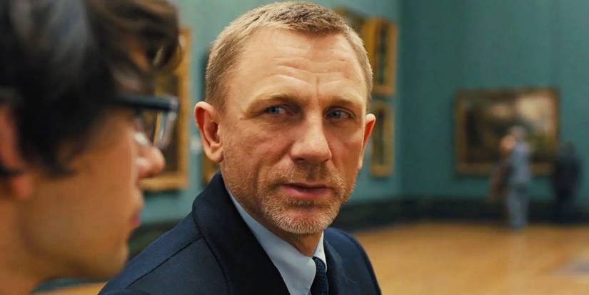 Daniel Craig as James Bond talking to Ben Whishaw as Q in an art museum in Skyfall