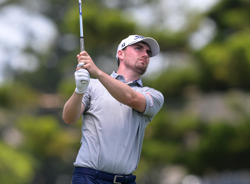Cameron Adam holds his finish on a wedge shot