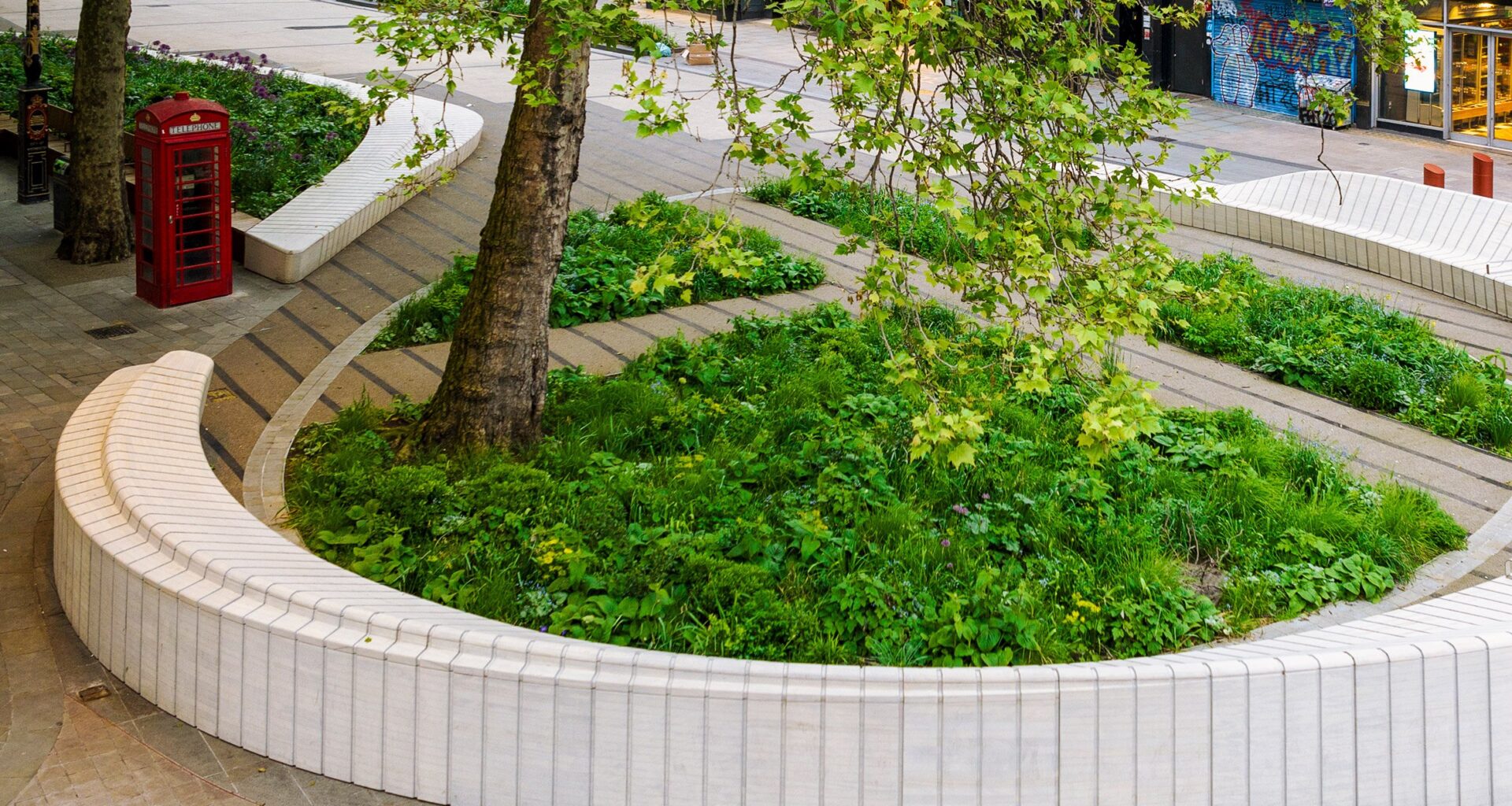 Undulating benches provide versatile public seating on London's Strand