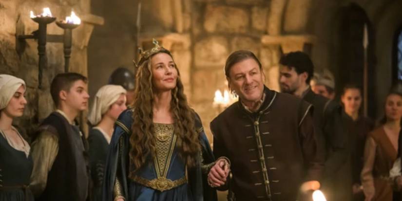 Sean Bean and Connie Nielsen walking together and smiling in MGM+ Robin Hood First Look