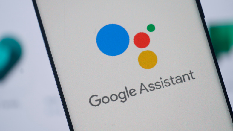 The Google Assistant logo on a smartphone.