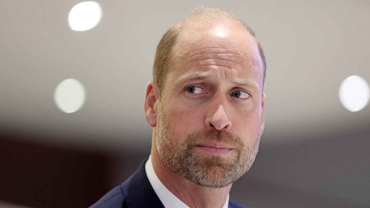 A close-up of Prince William looking annoyed and pensive.