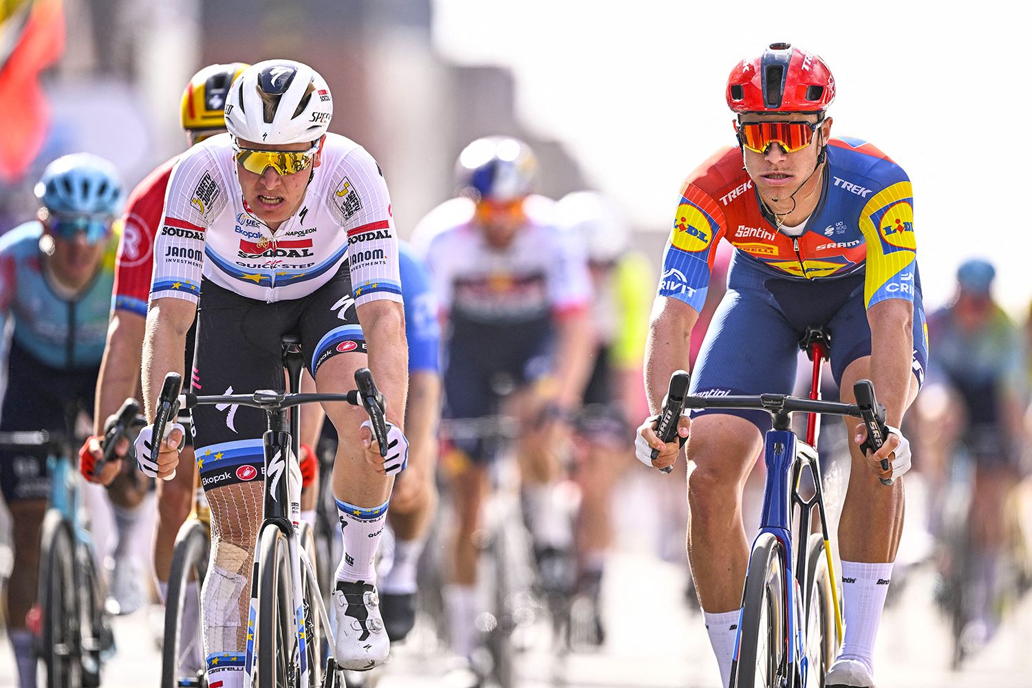 Quick-Step's Belgian team rider Tim Merlier and Lidl-Trek's Italian team rider Jonathan Milan cycle to the finish of the men's elite one day 250.3 Km (155 miles) cycling race 'Gent-Wevelgem - In Flanders Fields' from Ieper to Wevelgem on March 30, 2025. (Photo by JASPER JACOBS / Belga / AFP) / Belgium OUT (Photo by JASPER JACOBS/Belga/AFP via Getty Images)