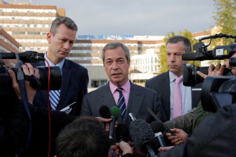 FILE PHOTO: Nigel Farage United Kingdom Independence Party (UKIP) member and MEP, talks to journalists as he stands with Member of the European Parliament Nathan Gill and UKIP press officer Hermann Kelly as they leave the Hautepierre Hospital in Strasbourg, France, October 6, 2016, where Steven Woolfe, of the United Kingdom Independence Party (UKIP), was in, after suffering "epileptic-like" seizures on Thursday following an "altercation" at a heated European Parliament meeting on the party's future. REUTERS/Vincent Kessler/File Photo