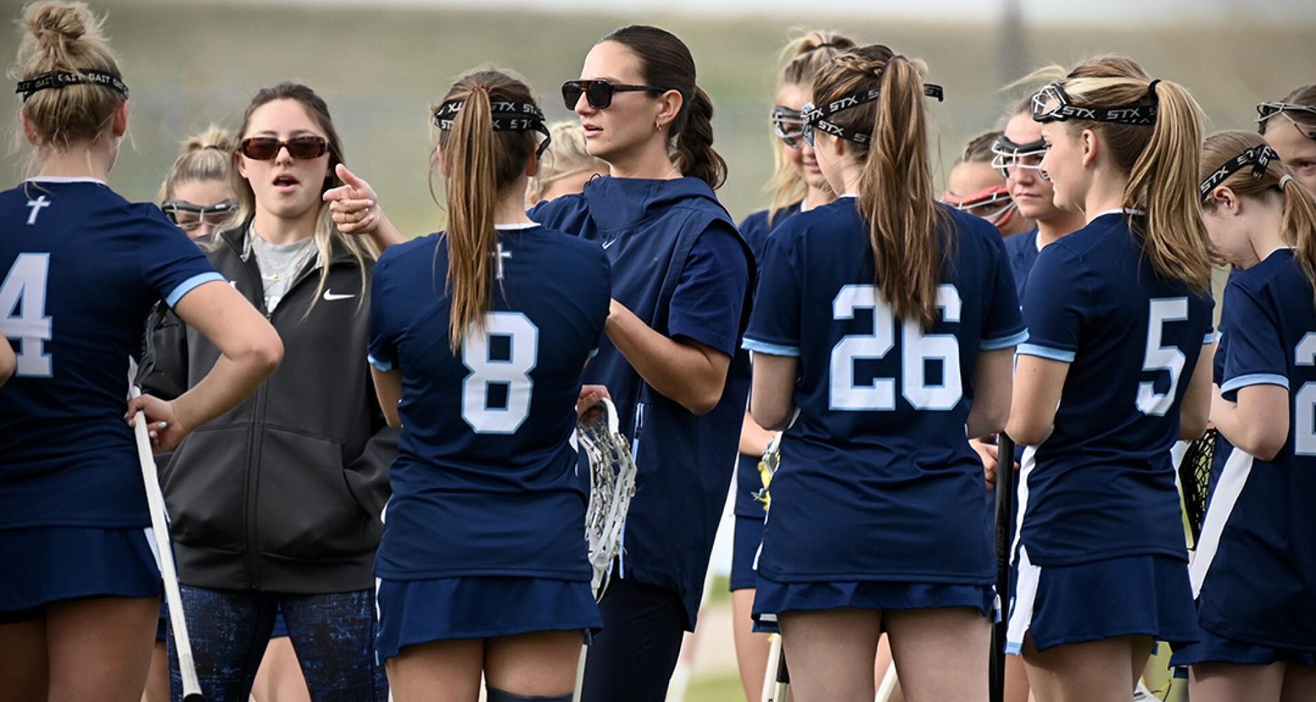 Sam Geiersbach gives instructions to her Valor Christian girls lacrosse team