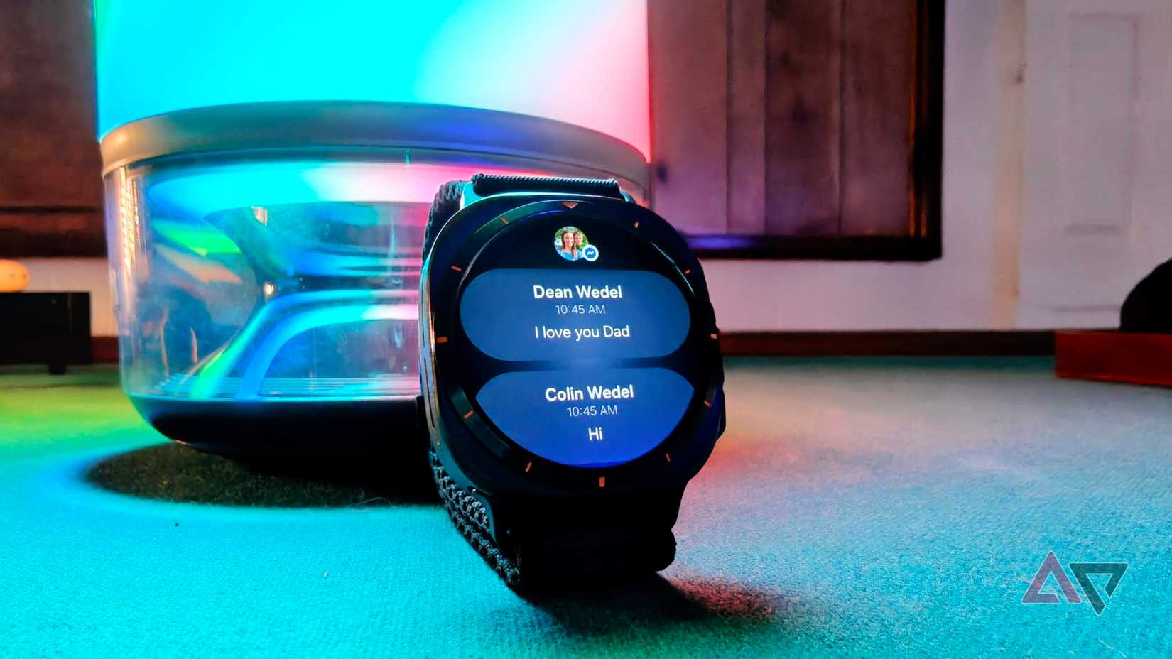 Samsung Galaxy Watch Ultra showing nested notifications leaning against Govee Table Lamp 2 Pro