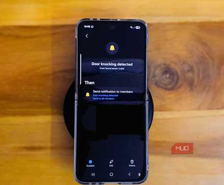 Samsung Galaxy Z Flip 6 kep on a Wooden table with a keyboard on the edge 