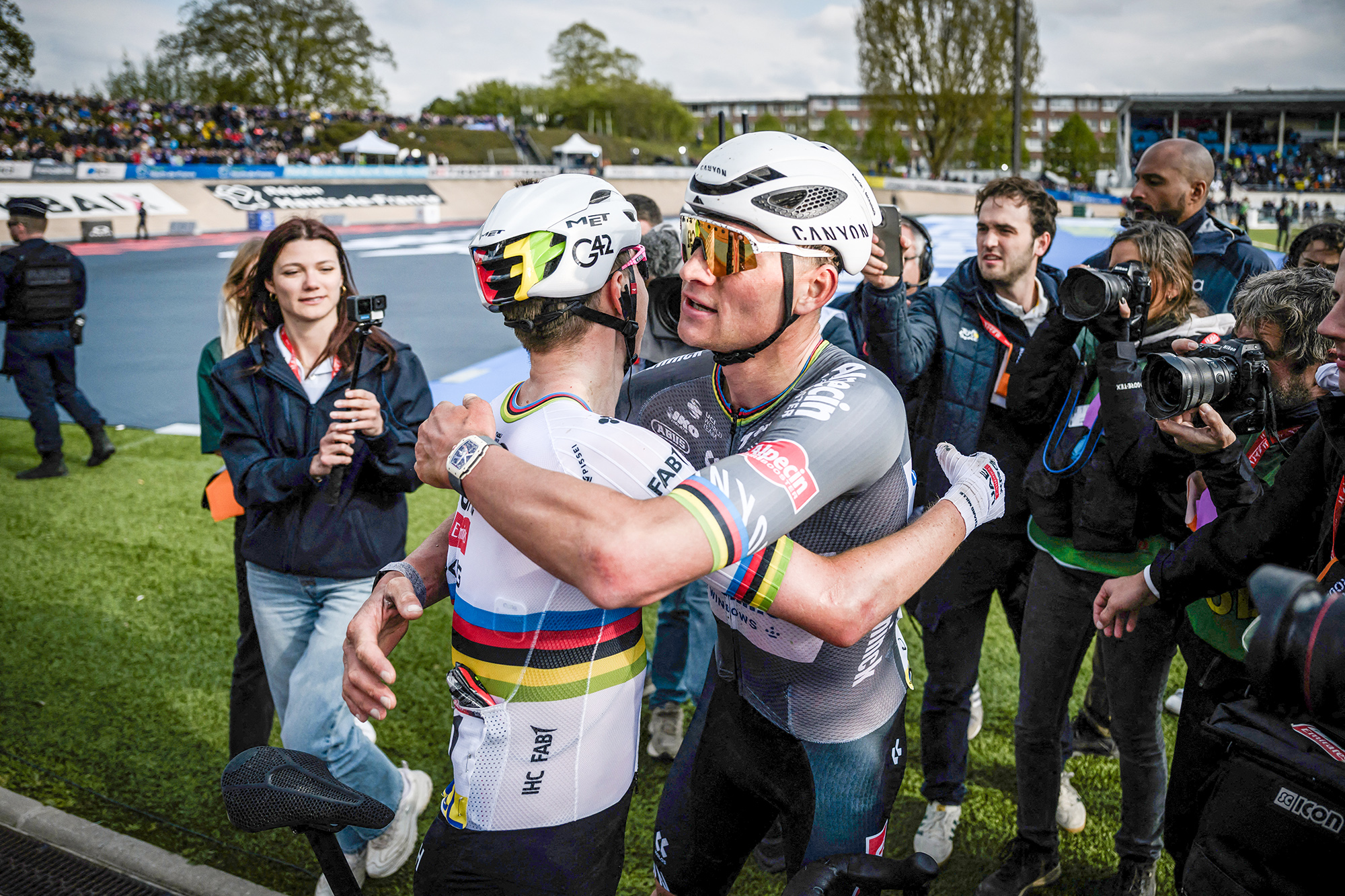 Second placed UAE Team Emirates' Slovenian rider Tadej Pogacar (L) and first placed Alpecin-Deceuninck's Dutch rider Mathieu van der Poel celebrate after the 122nd edition of the Paris-Roubaix one-day classic cycling race, 259,2 km between Compiegne and Roubaix, northern France on April 13, 2025. (Photo by JEFF PACHOUD / AFP) (Photo by JEFF PACHOUD/AFP via Getty Images)