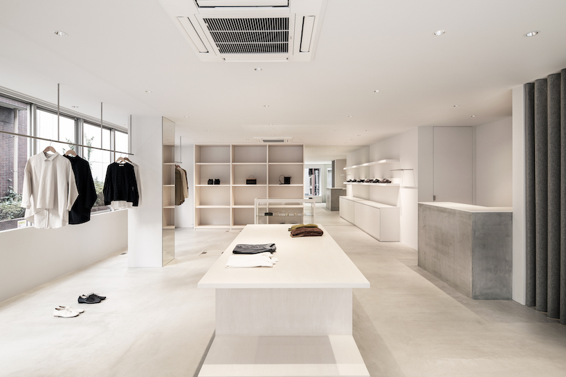 white-stained wood shapes soft bright interiors for tokyo apparel store