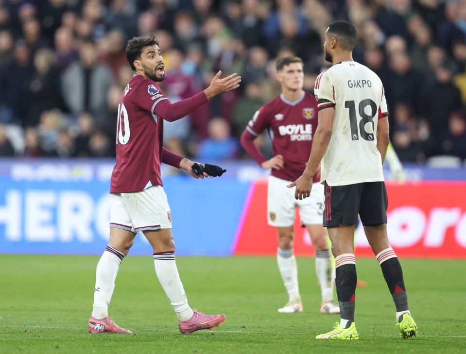 West Ham United’s Lucas Paqueta in discussion with Liverpool’s Cody Gakpo after being sent off during the Premier League match between West Ham United and Liverpool at London Stadium on November 30, 2025 in London, England.