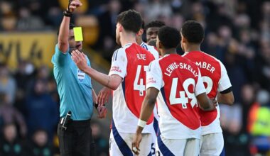 WOLVERHAMPTON, ENGLAND: Referee Michael Oliver drops a yellow card before showing Myles Lewis-Skelly of Arsenal a red card after he fouled Matt Doh...