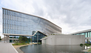 glass curtain wall envelops richter gedeon’s headquarters by ZDA in budapest