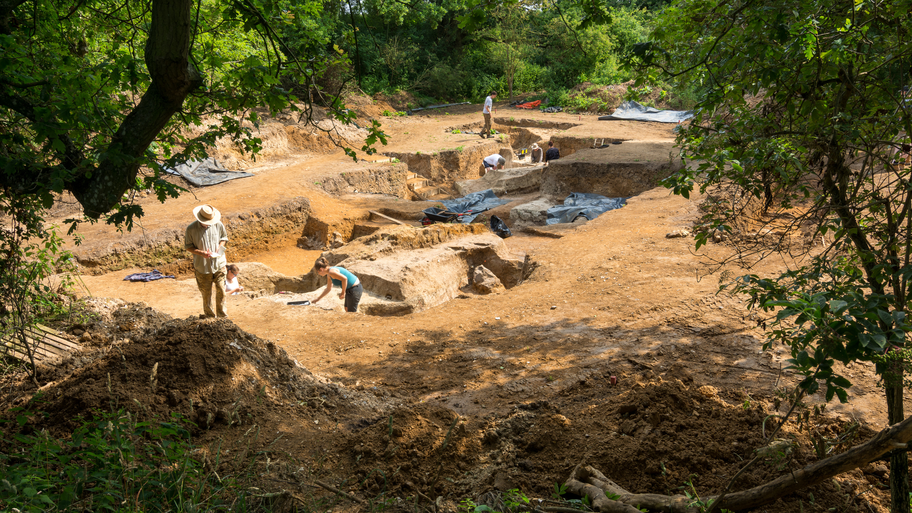 Archaeologists excavating 400,000-year-old pond sediments at Barnham, Suffolk, looking for evidence of fire-making.