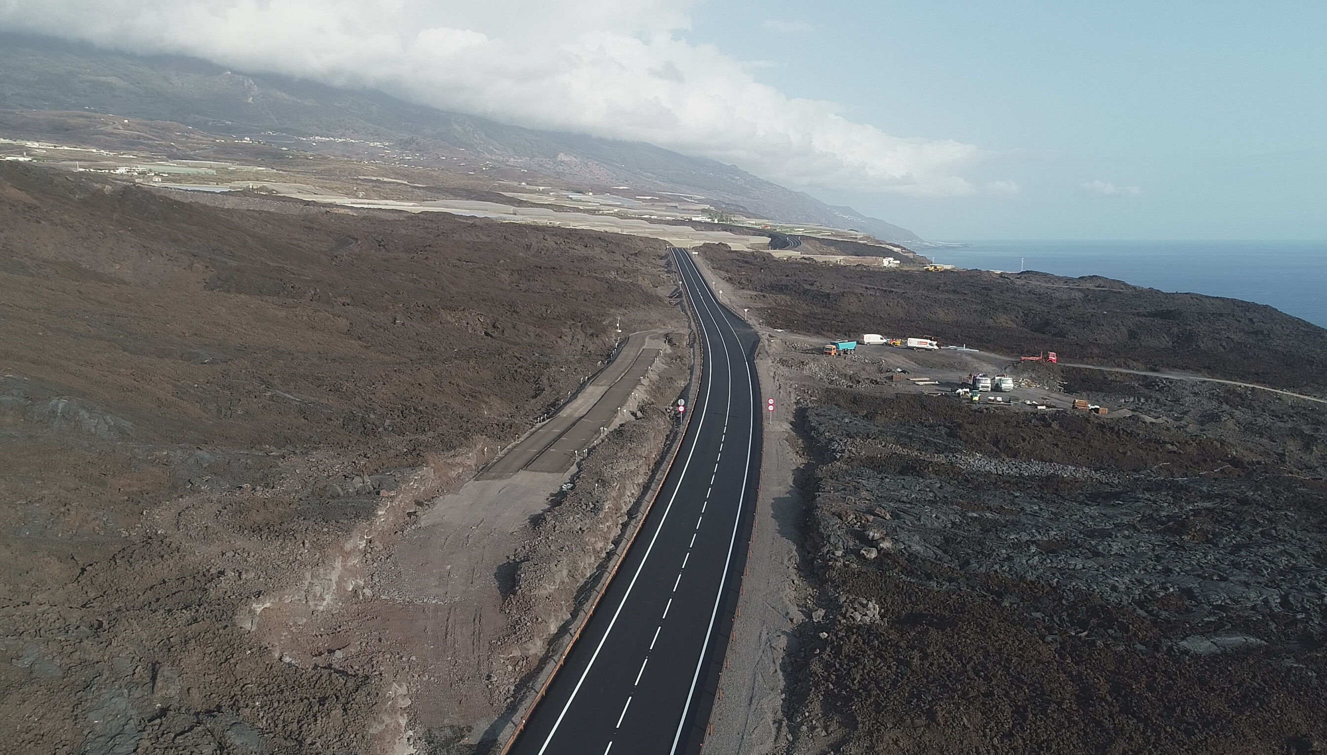 Aerial view of a new highway built on solidified lava fields between Tazacorte and Puerto Naos on La Palma, Canary Islands.