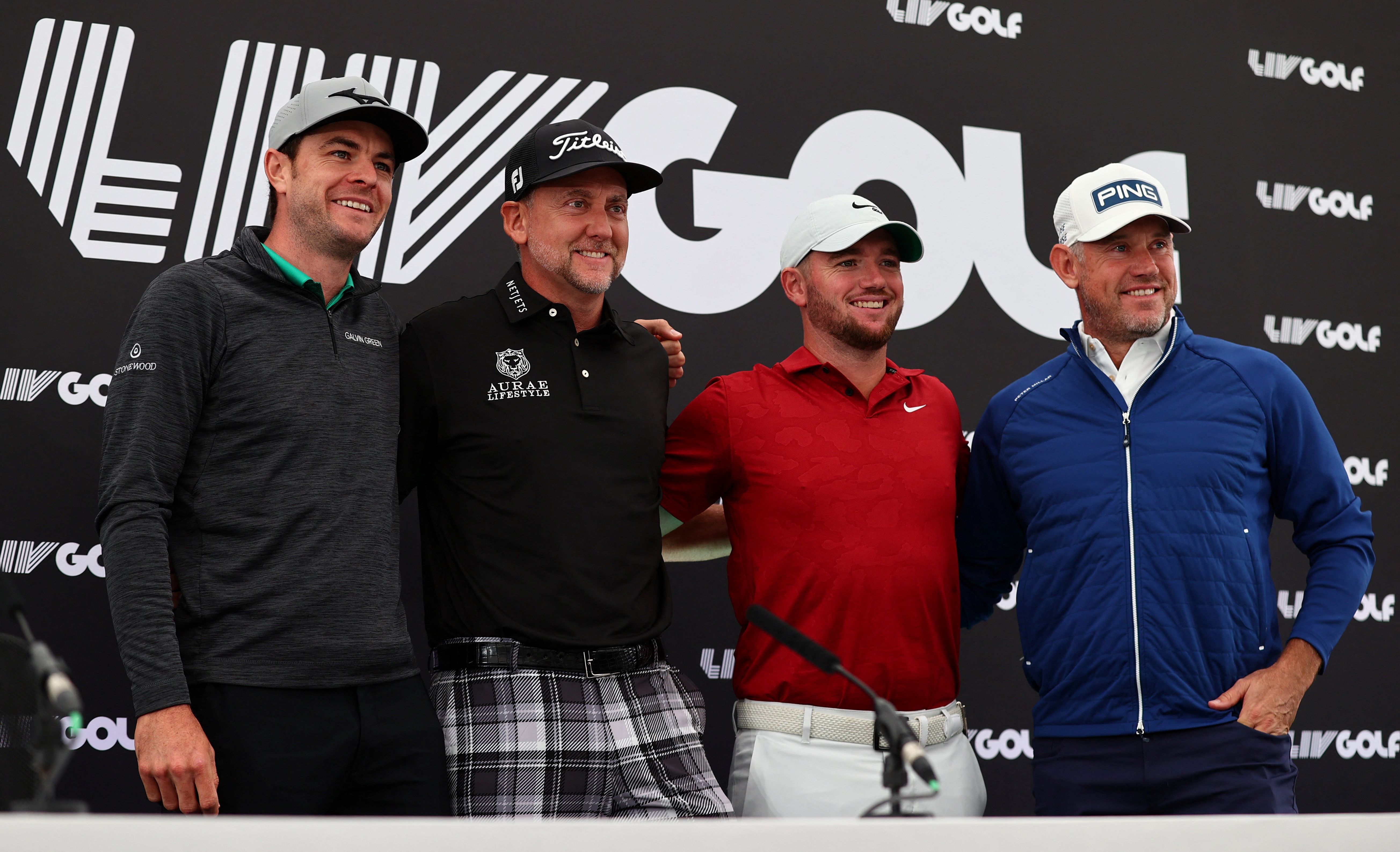 English golfers Laurie Canter, Ian Poulter, Sam Horsfield, and Lee Westwood of team Majesticks GC posing for a press conference.
