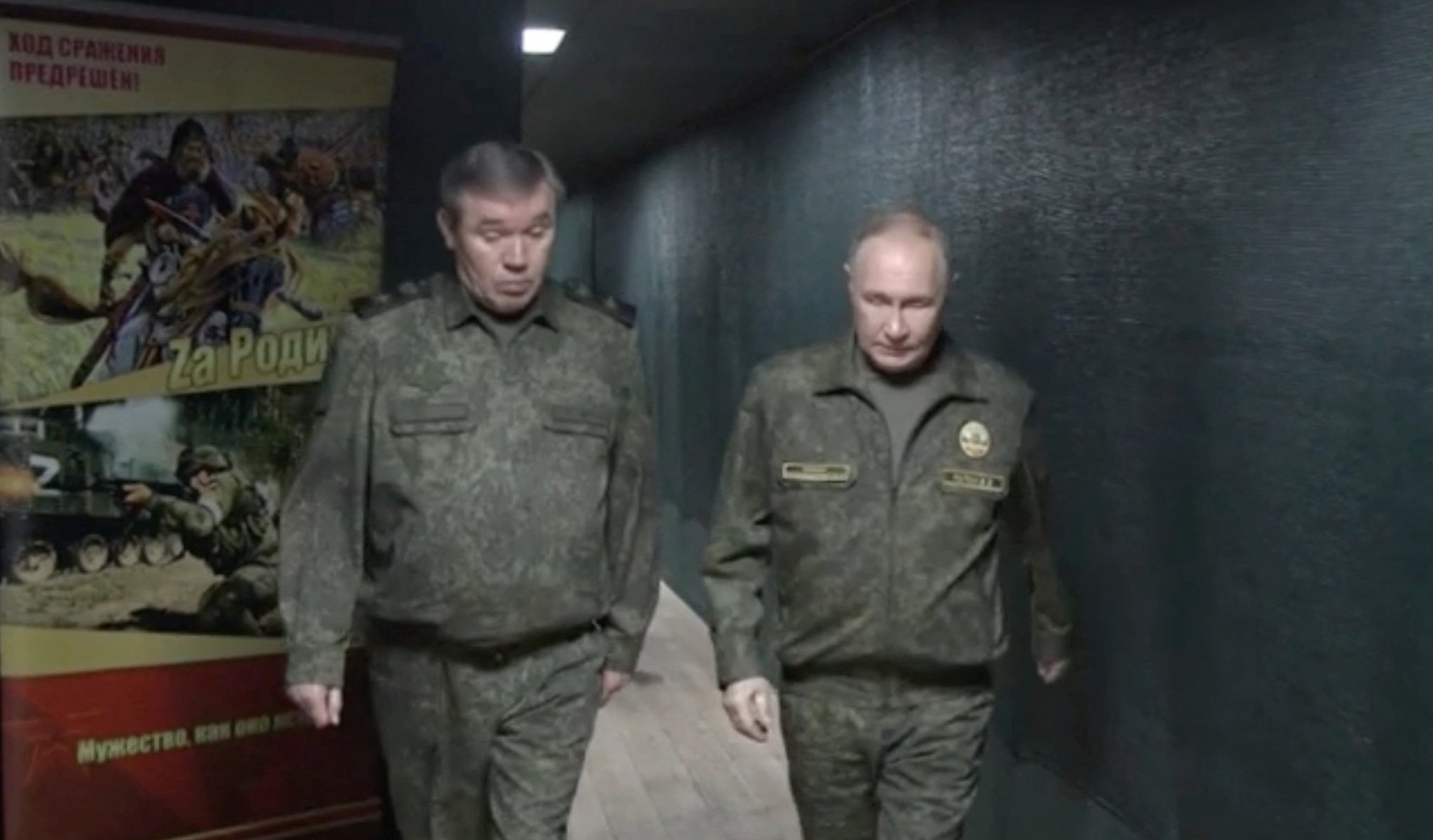 Russian President Vladimir Putin and Chief of the General Staff of Russian Armed Forces Valery Gerasimov walk at the command post of the Russian forces "West" grouping.
