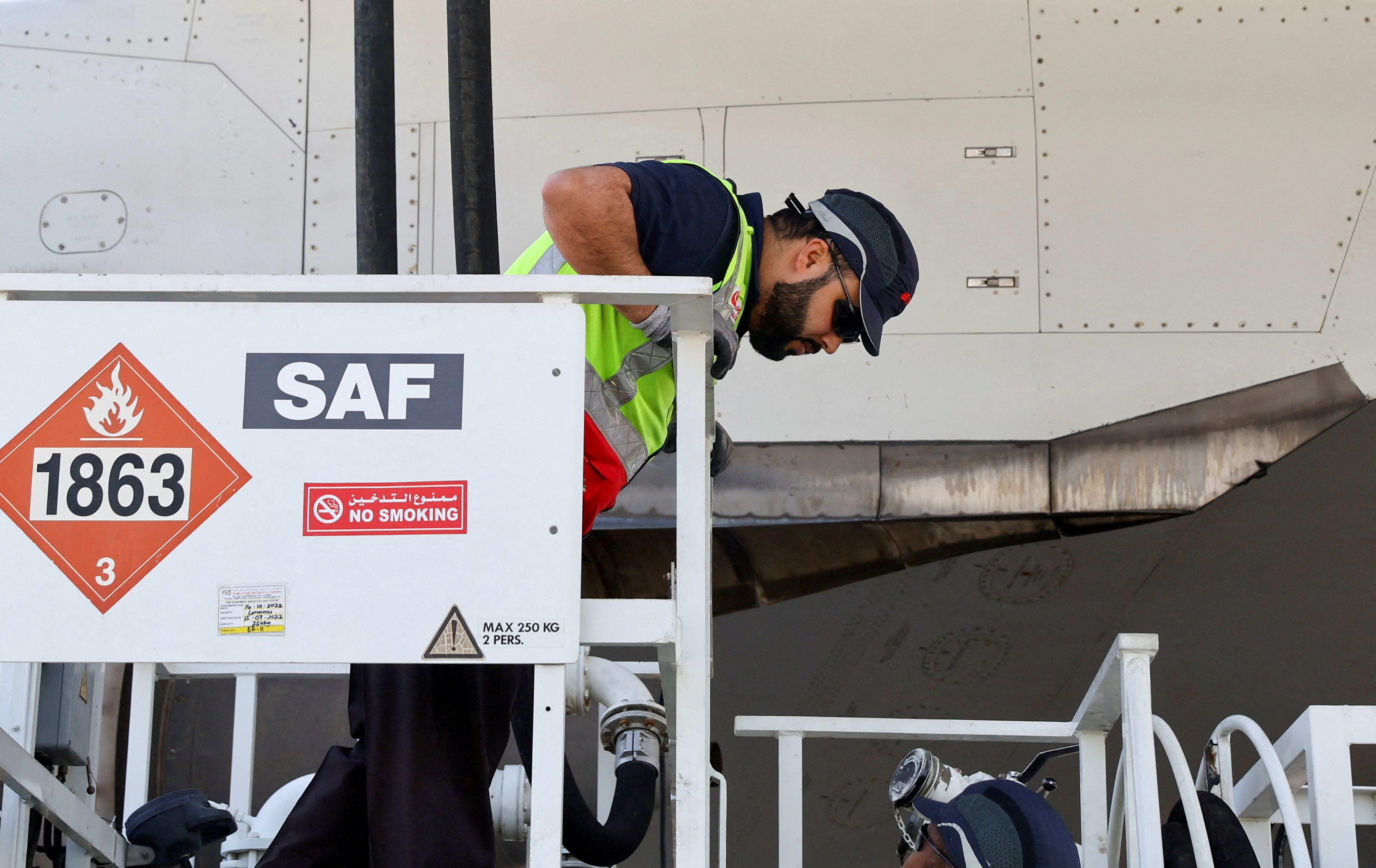 A Emirates Airline Boeing 777-300ER being filled with sustainable aviation fuel