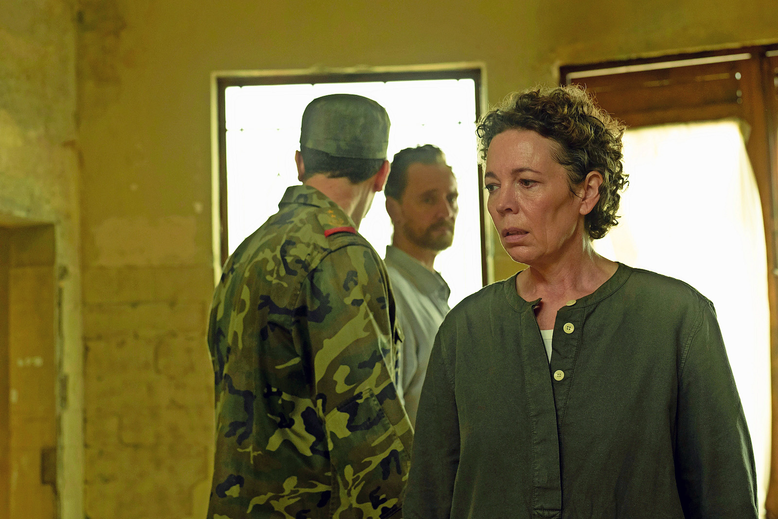 Olivia Colman as Angela Burr, Tom Hollander as Richard Roper, and a man in military uniform in The Night Manager S2.