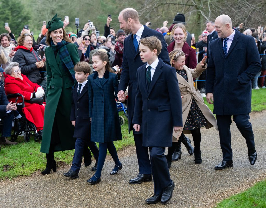 catherine, Princess of Wales, Prince Louis of Wales, Princess Charlotte of Wales, Prince William, Prince of Wales Prince George of Wales, Mia Tindall and Mike Tindall walk down path lined with people