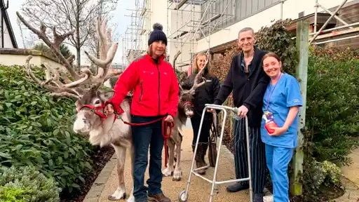 Patient Sean McAnulty with physio assistant at the hospice Charmaine Geehan with reindeer at Somerton house. 