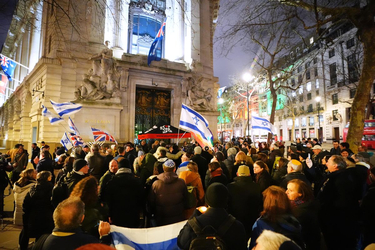 People hold a vigil outside the Australian High Commission in central London, following the terrorist attack targeting a Jewish celebration at Bondi Beach in Sydney, Australia, where at least 12 people have been killed. 