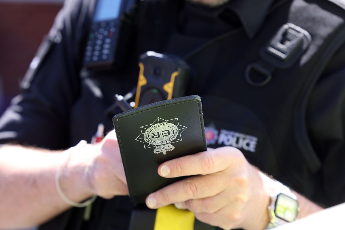 A police officer writing in his notebook