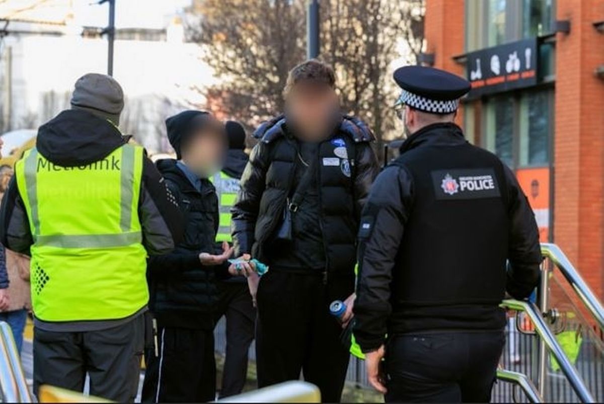 Police confront a suspect at a Metrolink stop.