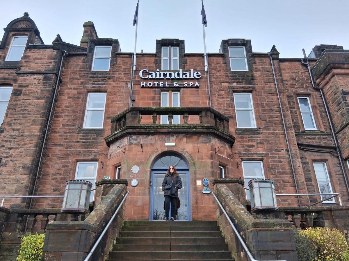 Woman standing in front of The Cairndale Hotel and Spa